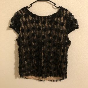 Ann Taylor elegant and fun black rosette blouse. A night out or pair with jeans.